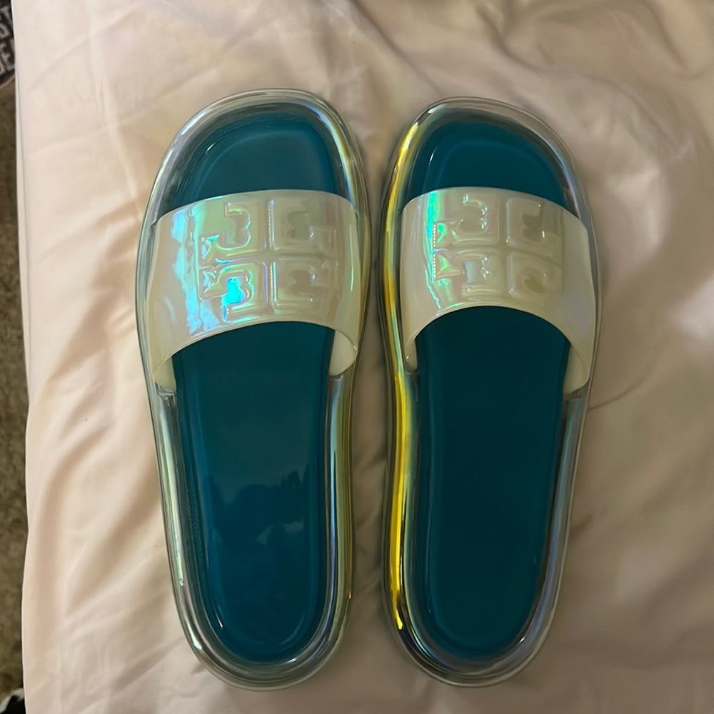 NWOT never worn Tory Burch blue and iridescent white jelly slides.